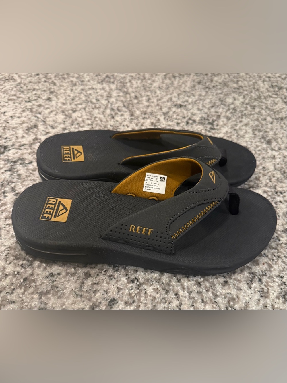 Reef Men's Black and Gold Casual Flip Flops